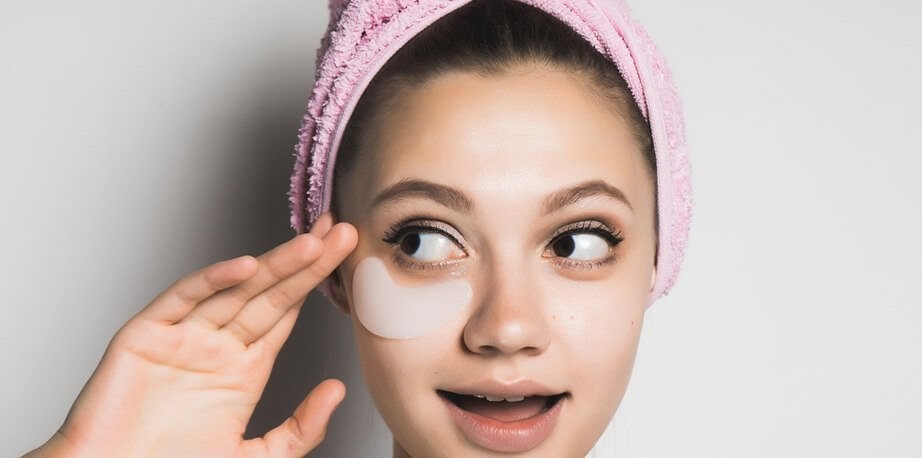 young-girl-using-cream-for-dark-circles-removal