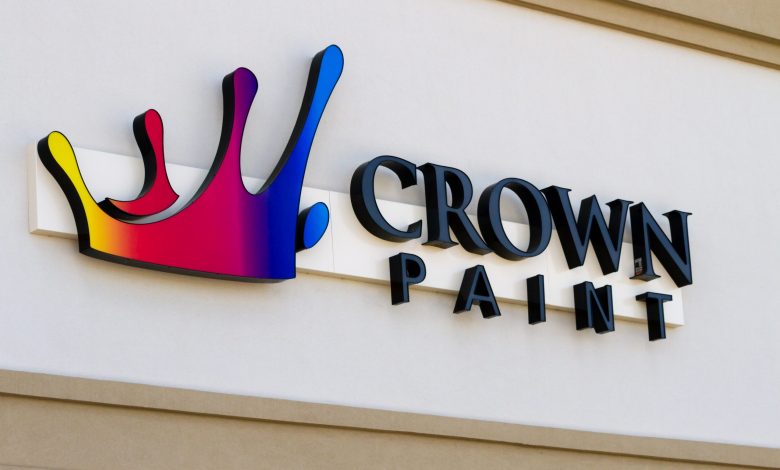 A channel letter sign install on a paint shop with the name of crown paint